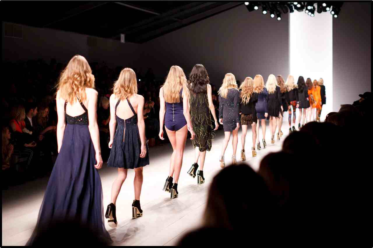 Group of fashion models showcasing the latest collection on the runway.